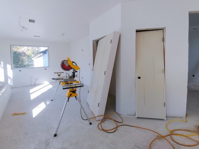 Interior construction of housing with drywall installed door for a new home before installing